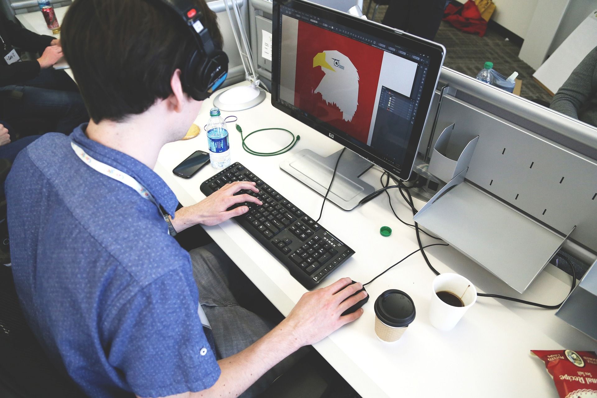 young man designing on a computer